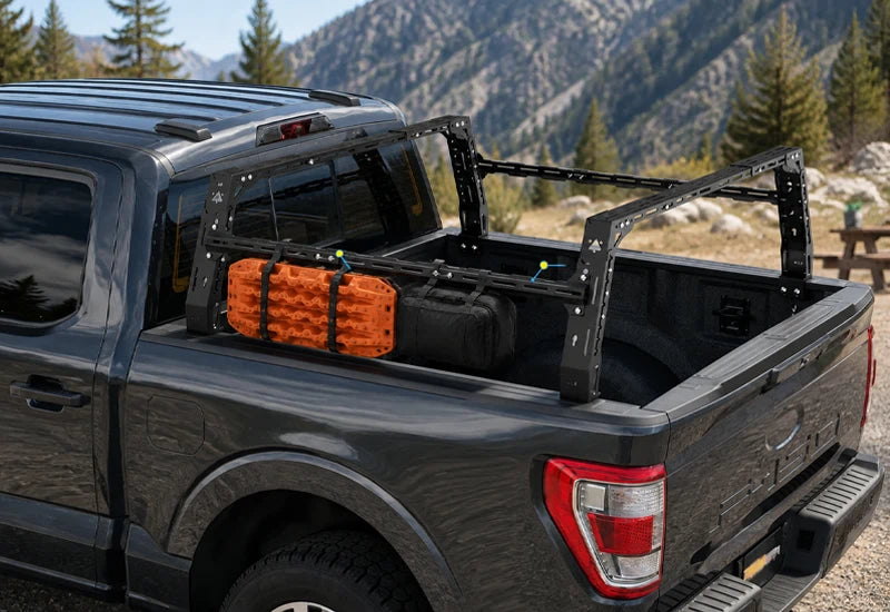 Modular truck bed rack with recovery gear mounted on the side
